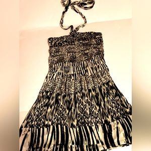 Black and white bouncy dress with tie strap around the neck